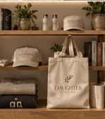 DaughterHouse hats, totes, and retail merchandise on wooden shelves